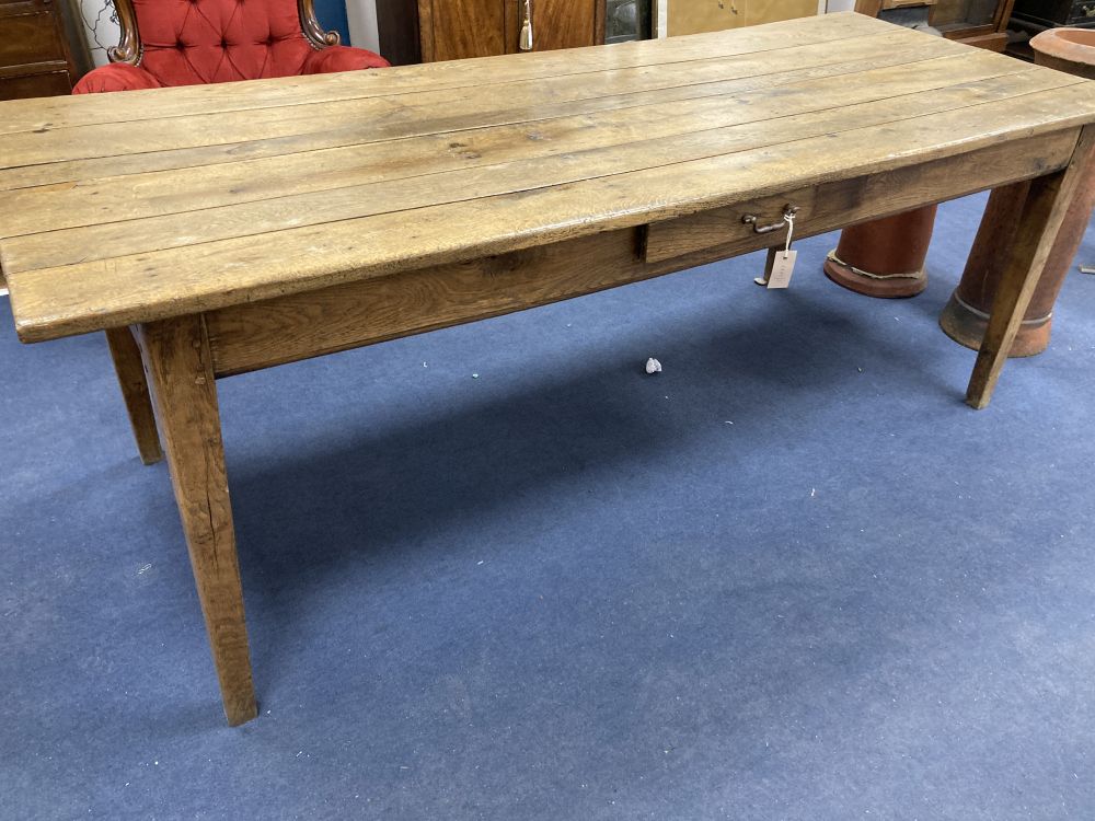 A 19th century French oak and elm farmhouse kitchen table, width 203cm depth 82cm height 73cm